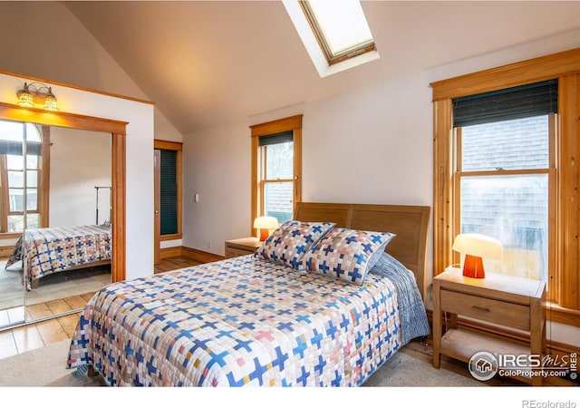 2645 5th St, Boulder, CO 80304 - bedroom with a skylight, vaulted ceiling, and hardwood / wood-style floors