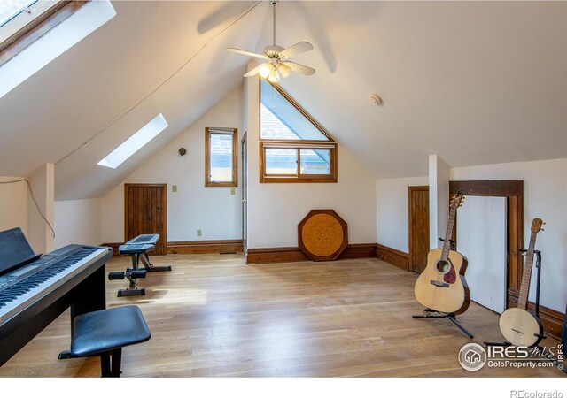 2645 5th St, Boulder, CO 80304 - bedroom featuring a skylight, wood finished floors, baseboards, and lofted ceiling