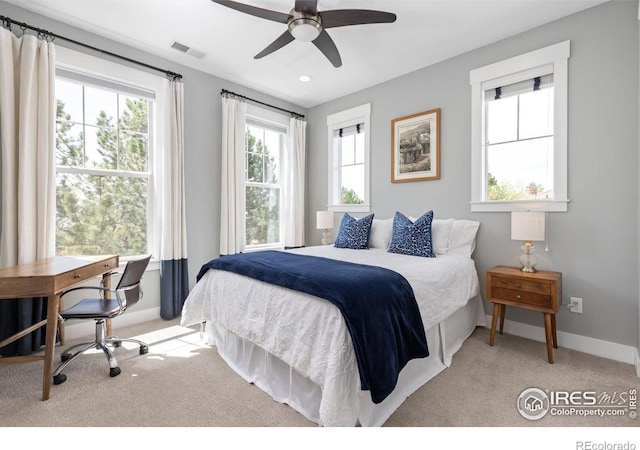 carpeted bedroom with baseboards, recessed lighting, and a ceiling fan