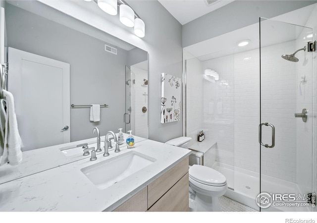 7861 W 51st Ave, Arvada, CO 80002 - bathroom featuring a stall shower, vanity, and tile patterned floors
