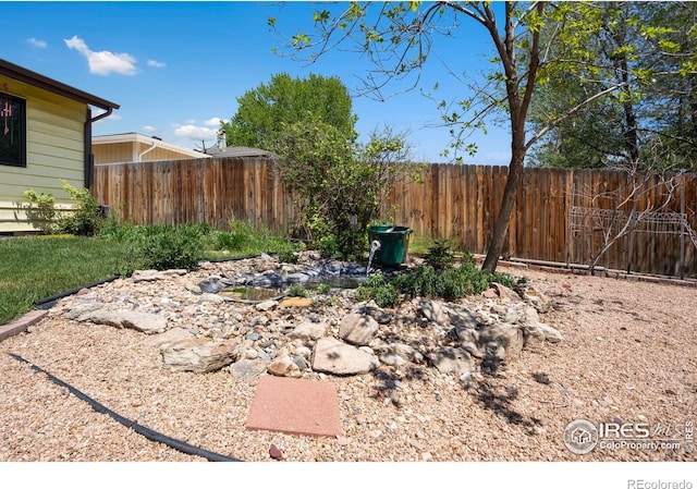 view of yard featuring fence
