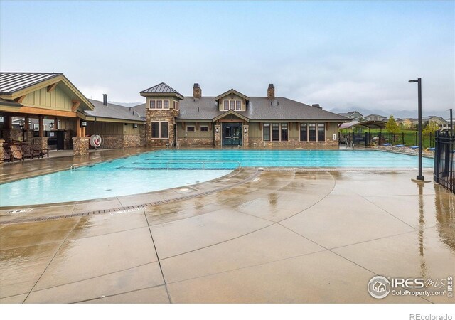 community pool featuring fence