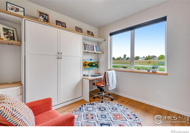725 Amelia Ln, Lafayette, CO 80026 - office space with baseboards and light wood-type flooring