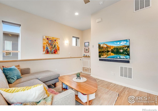 725 Amelia Ln, Lafayette, CO 80026 - living area featuring wood finished floors, baseboards, and recessed lighting
