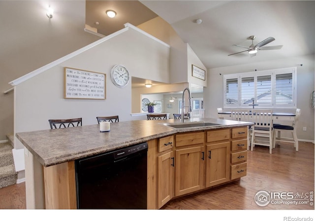 1318 Chamois Dr, Severance, CO 80550 - kitchen with black dishwasher, a sink, lofted ceiling, ceiling fan, and an island with sink