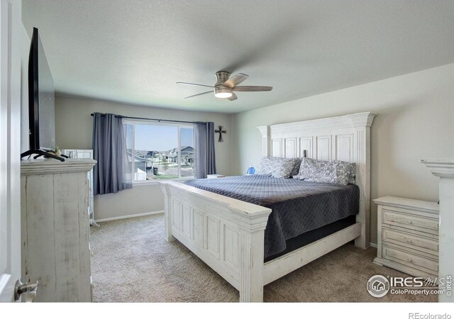 1318 Chamois Dr, Severance, CO 80550 - bedroom with light carpet, a ceiling fan, and baseboards