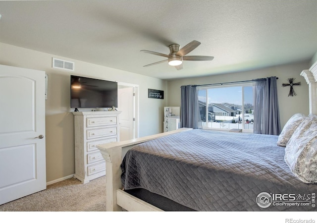 1318 Chamois Dr, Severance, CO 80550 - bedroom featuring light colored carpet, ceiling fan, baseboards, and a textured ceiling