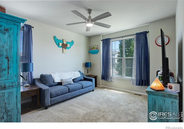 1318 Chamois Dr, Severance, CO 80550 - living area with carpet, ceiling fan, and baseboards