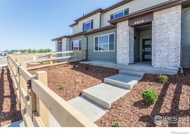 4905 Autumn Leaf Dr, Timnath, CO 80547 - entrance to property featuring covered porch and brick siding