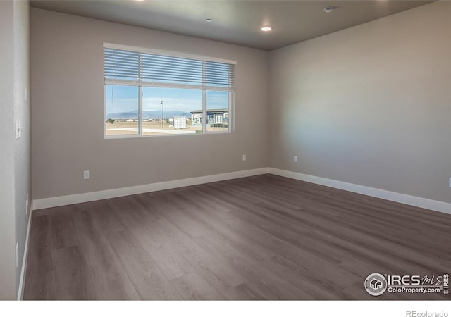 4905 Autumn Leaf Dr, Timnath, CO 80547 - empty room featuring wood finished floors, baseboards, and recessed lighting