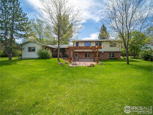 back of house with a patio, a pergola, a lawn, and brick siding