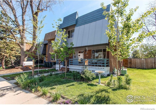 11656 Logan St, Northglenn, CO 80233 - view of front of house featuring brick siding and a porch