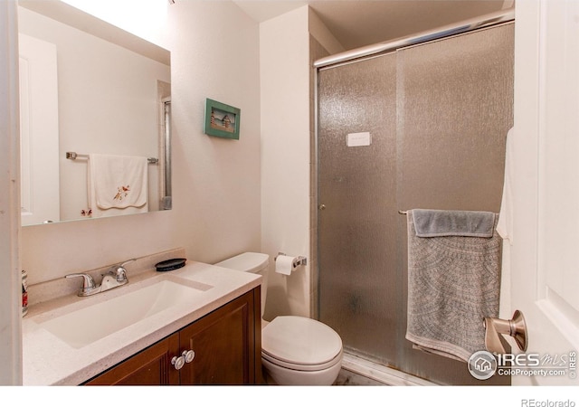 11656 Logan St, Northglenn, CO 80233 - full bathroom with a stall shower, toilet, and vanity
