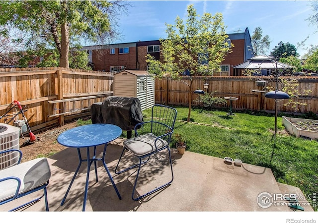 11656 Logan St, Northglenn, CO 80233 - view of patio / terrace featuring a storage unit, an outdoor structure, and cooling unit