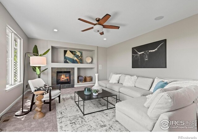 2458 Vale Way, Erie, CO 80516 - carpeted living area with ceiling fan, baseboards, built in features, a fireplace, and recessed lighting
