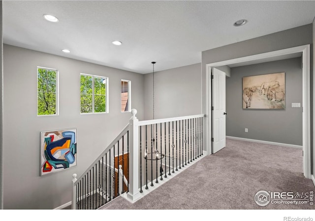 2458 Vale Way, Erie, CO 80516 - hall featuring carpet flooring, an upstairs landing, recessed lighting, and baseboards
