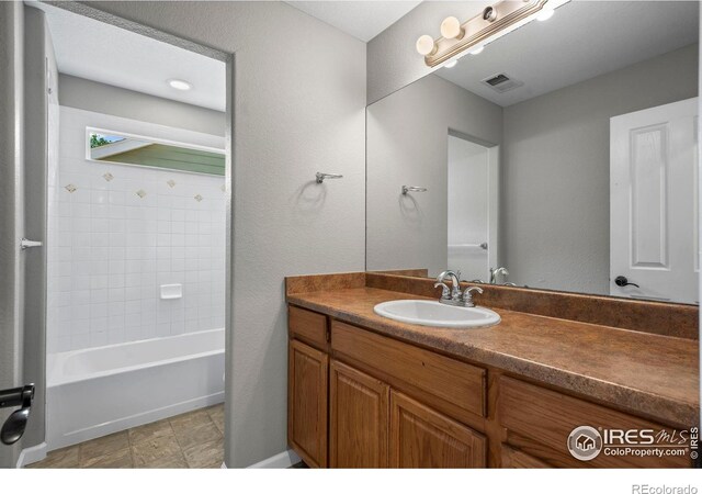 2458 Vale Way, Erie, CO 80516 - bathroom featuring vanity and shower / bathtub combination