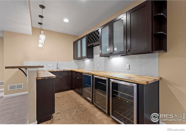 2458 Vale Way, Erie, CO 80516 - kitchen with wood counters, beverage cooler, open shelves, and backsplash