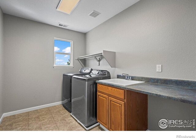 2458 Vale Way, Erie, CO 80516 - washroom with independent washer and dryer, baseboards, and cabinet space