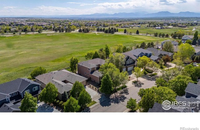 2458 Vale Way, Erie, CO 80516 - aerial perspective of suburban area featuring a golf course and a mountain backdrop
