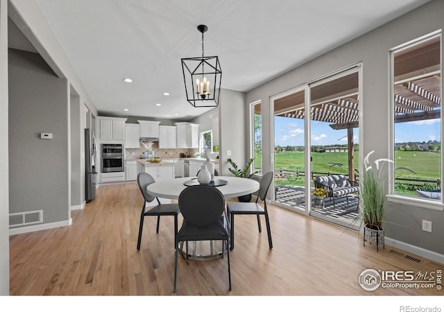 2458 Vale Way, Erie, CO 80516 - dining space with a chandelier, light wood-style flooring, baseboards, and recessed lighting