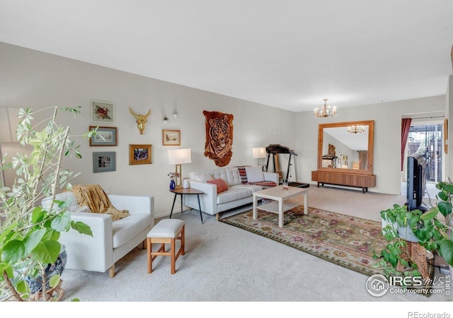 carpeted living area with a chandelier