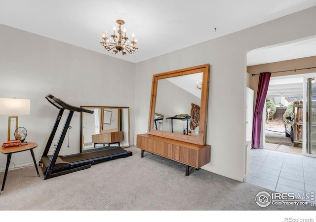 exercise area with carpet flooring, a chandelier, and baseboards