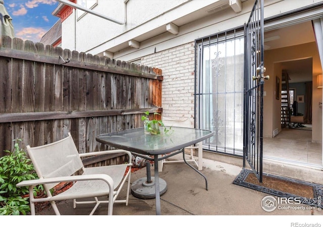 view of patio featuring fence