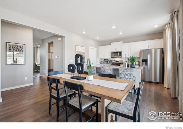 dining area with dark wood-style floors, recessed lighting, and baseboards