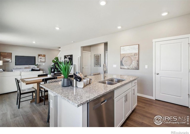 kitchen with dishwasher, a sink, dark wood finished floors, white cabinets, and recessed lighting