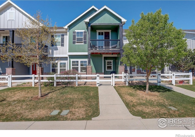 3051 County Fair Ln Unit 2, Fort Collins, CO 80528 - view of front of home featuring a balcony and board and batten siding