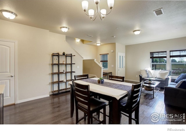 3051 County Fair Ln Unit 2, Fort Collins, CO 80528 - dining area with dark wood finished floors, stairway, baseboards, and a chandelier