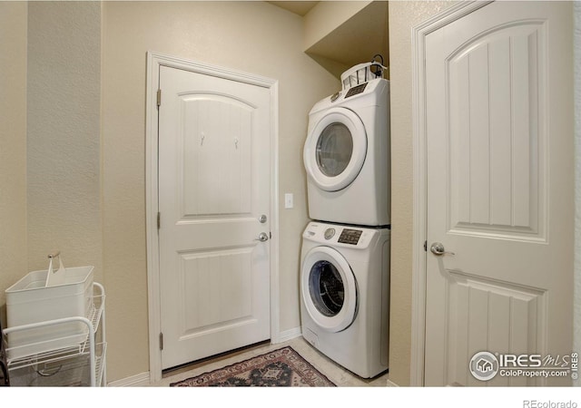 3051 County Fair Ln Unit 2, Fort Collins, CO 80528 - laundry room with stacked washing machine and dryer and baseboards