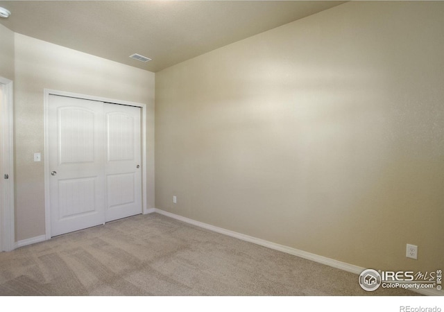 3051 County Fair Ln Unit 2, Fort Collins, CO 80528 - unfurnished bedroom with carpet flooring, baseboards, and a closet