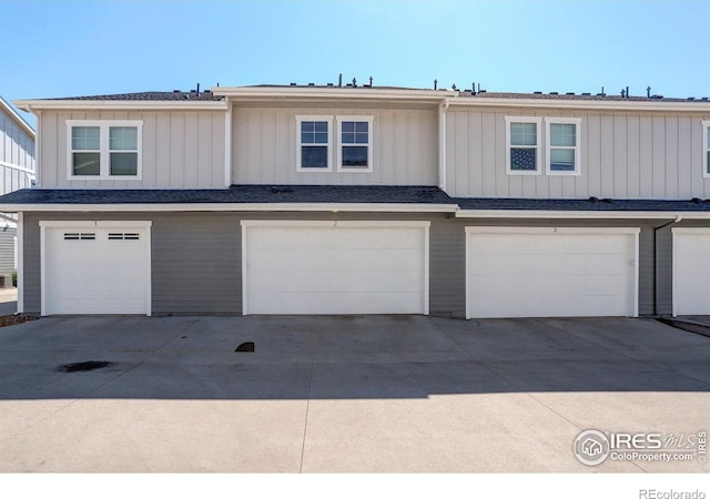 3051 County Fair Ln Unit 2, Fort Collins, CO 80528 - view of property featuring an attached garage and driveway