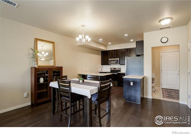 3051 County Fair Ln Unit 2, Fort Collins, CO 80528 - dining space with a chandelier, dark wood-style floors, baseboards, and recessed lighting