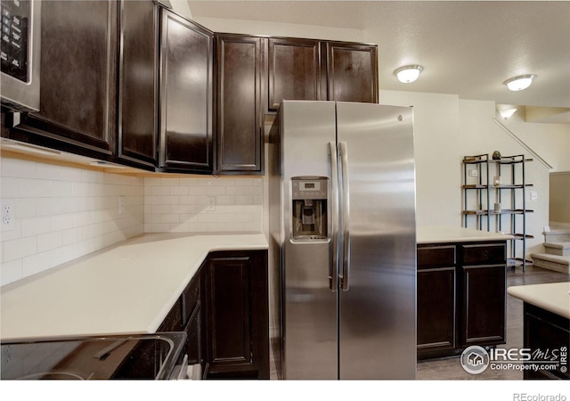 3051 County Fair Ln Unit 2, Fort Collins, CO 80528 - kitchen with stainless steel appliances, backsplash, dark brown cabinetry, and light countertops