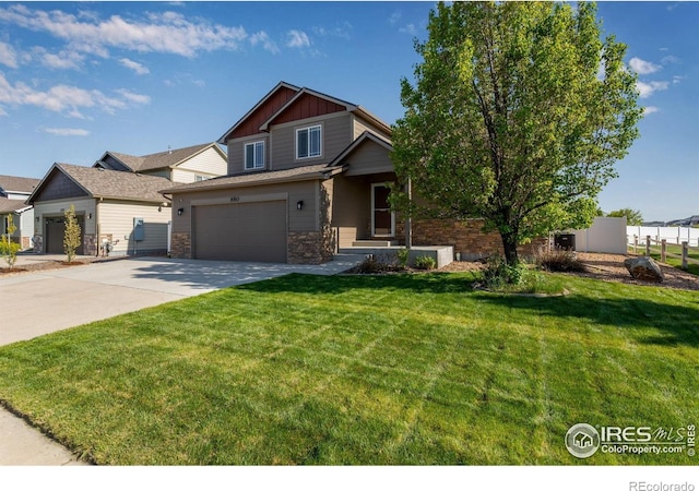 craftsman inspired home featuring stone siding, driveway, board and batten siding, and an attached garage
