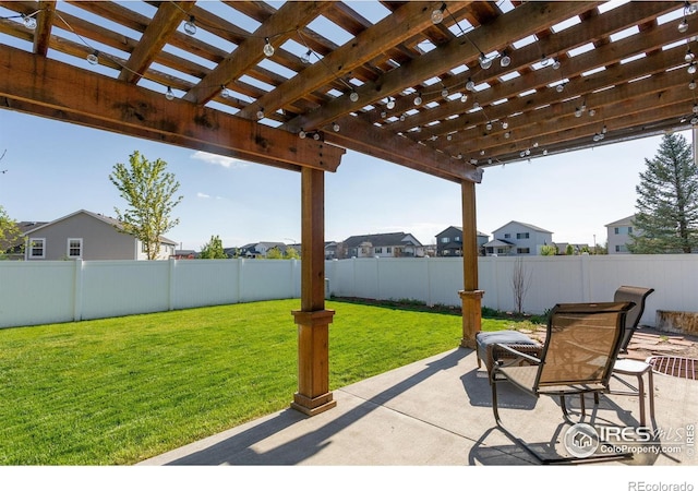 view of patio / terrace with a pergola and a residential view
