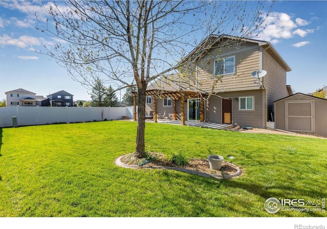 rear view of house featuring a storage shed, an outbuilding, and a patio area