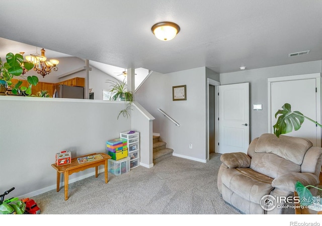 living area featuring a chandelier, carpet floors, baseboards, and stairs