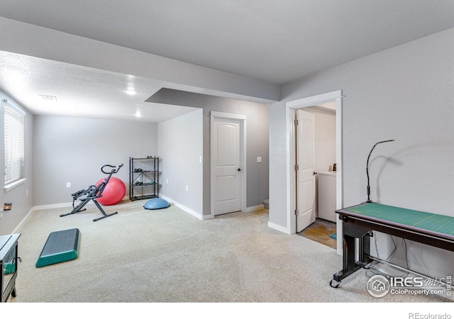 game room with carpet and baseboards