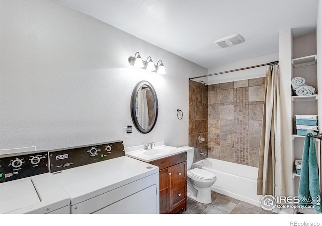 full bathroom with shower / tub combo, washer and clothes dryer, vanity, and toilet
