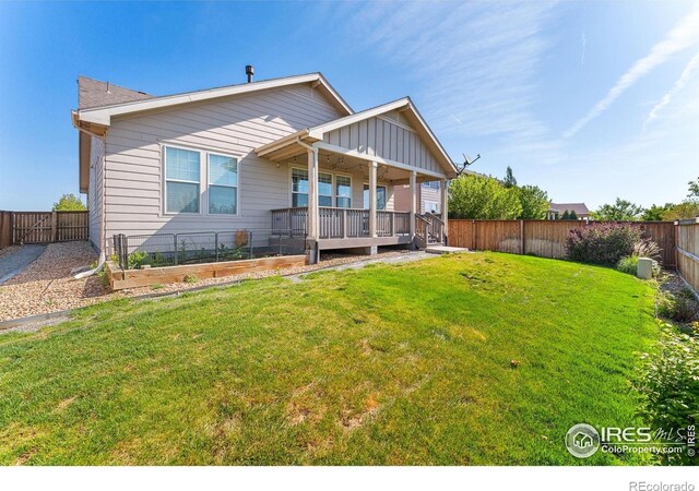 view of front of house with a garden and board and batten siding