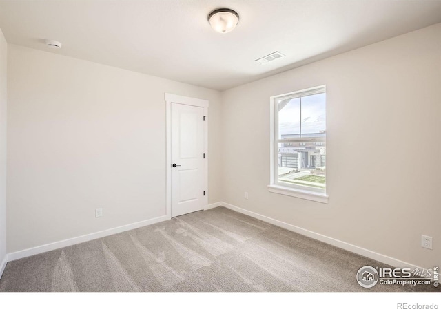 1679 Crystalline Dr, Windsor, CO 80550 - carpeted empty room with a smoke detector and baseboards