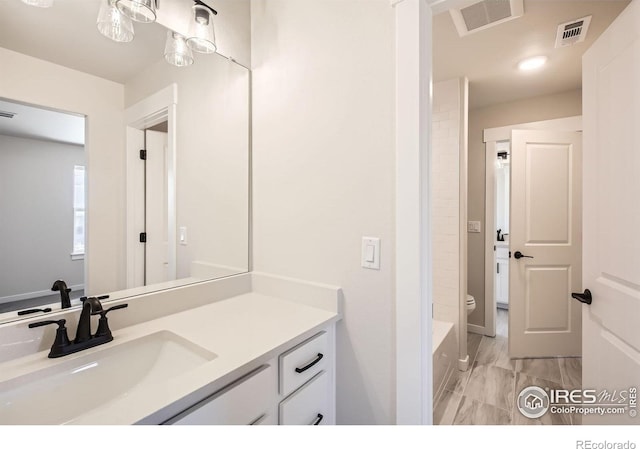 1679 Crystalline Dr, Windsor, CO 80550 - full bathroom with marble finish floors, toilet, and vanity