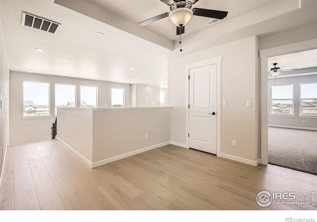 1679 Crystalline Dr, Windsor, CO 80550 - spare room featuring a ceiling fan, plenty of natural light, wood finished floors, and recessed lighting