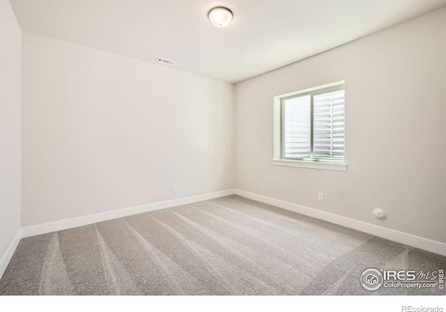 1679 Crystalline Dr, Windsor, CO 80550 - carpeted spare room with baseboards