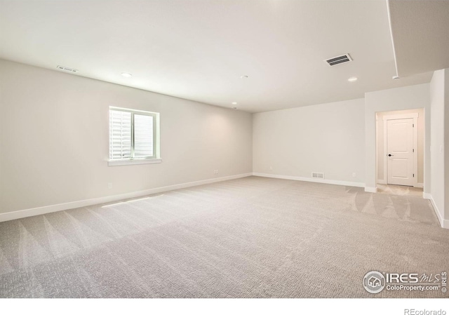 1679 Crystalline Dr, Windsor, CO 80550 - spare room featuring light carpet, baseboards, and recessed lighting