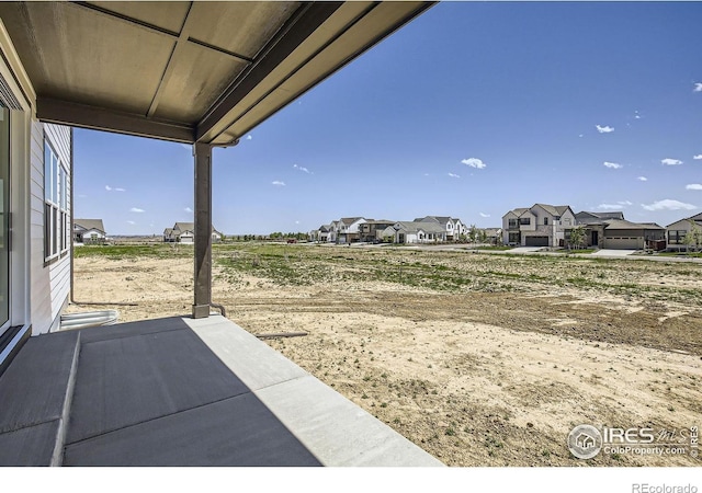 1679 Crystalline Dr, Windsor, CO 80550 - view of patio featuring a residential view